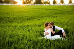 bride and groom in field