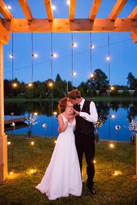 bride and groom on lake